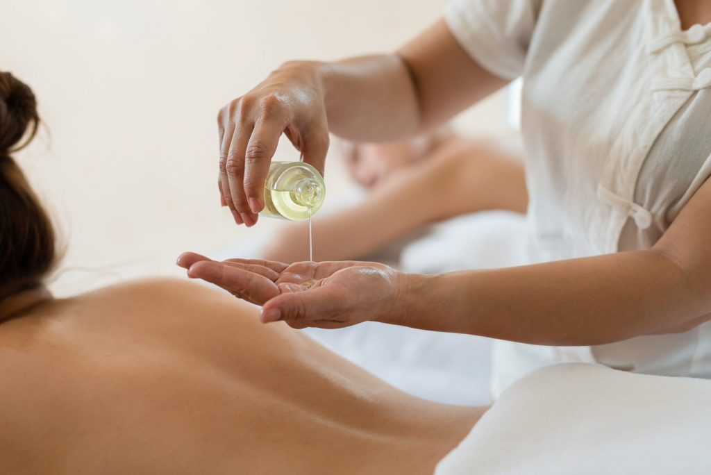 Warm herbal massage oils chosen for your dosha